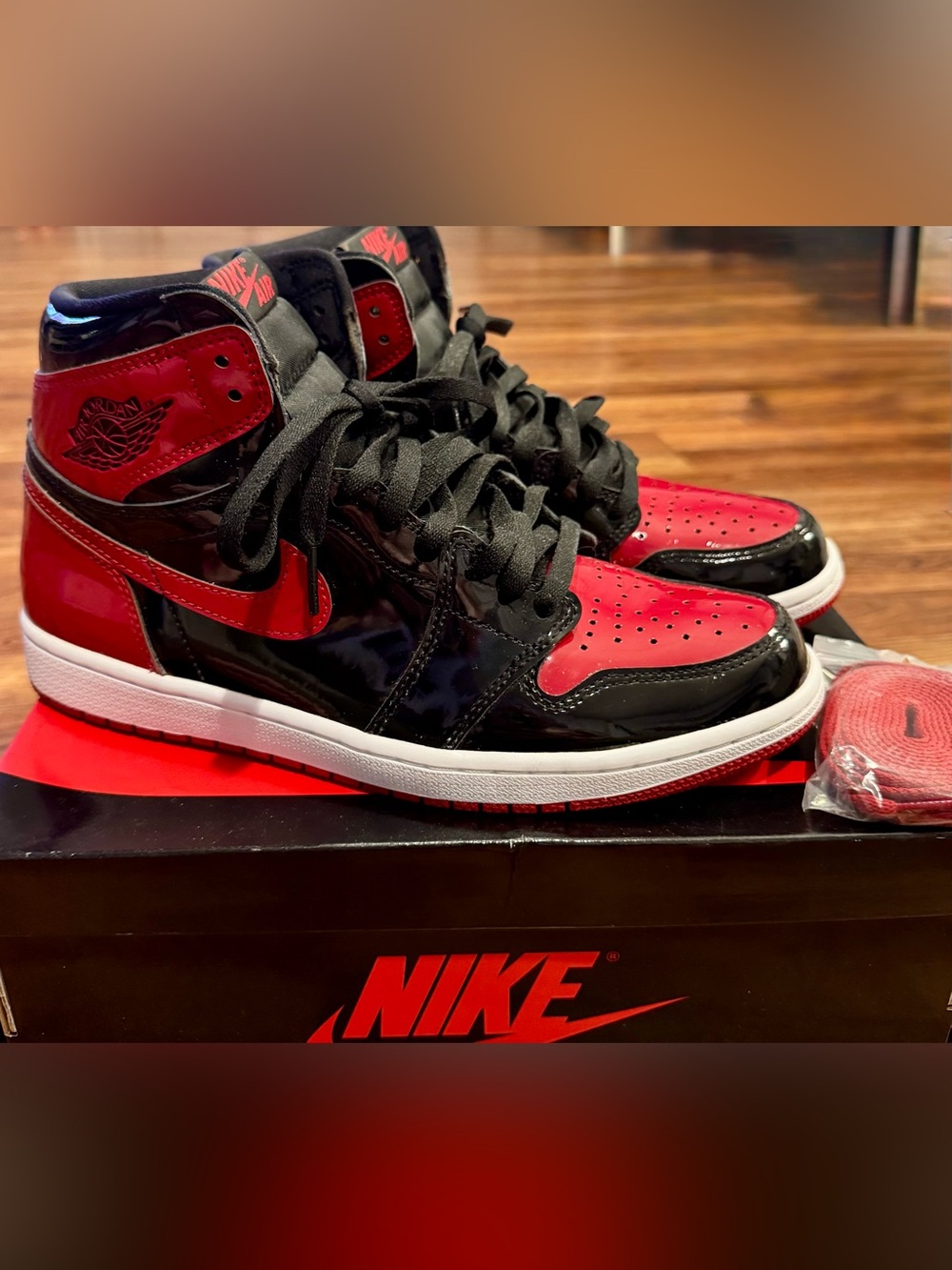 Nike Men’s Black and Red Patent Leather High-Top Sneakers